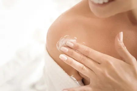 Woman applying cream